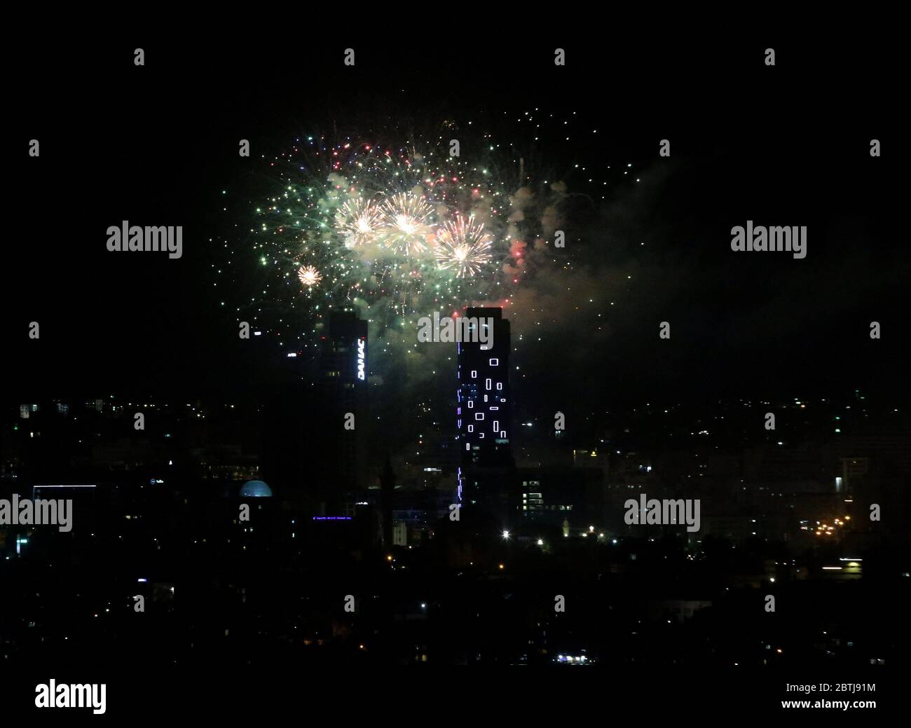 May 25, 2020: Amman, Jordan. 25 May 2020. Fireworks are displayed in Amman to celebrate the 74th anniversary of Jordan Independence Day. The commemoration of Jordan National Day, which is celebrated every year on 25th May, included fireworks, military parades, and a speech by King Abdullah II of Jordan. Independence Day marks the country's independence from British rule on 25 May 1946, and the following declaration of the Hashemite Kingdom of Jordan. The national flag was widely displayed to symbolise the significance of the day for the country (Credit Image: © Stringer/IMAGESLIVE via ZUMA Stock Photo
