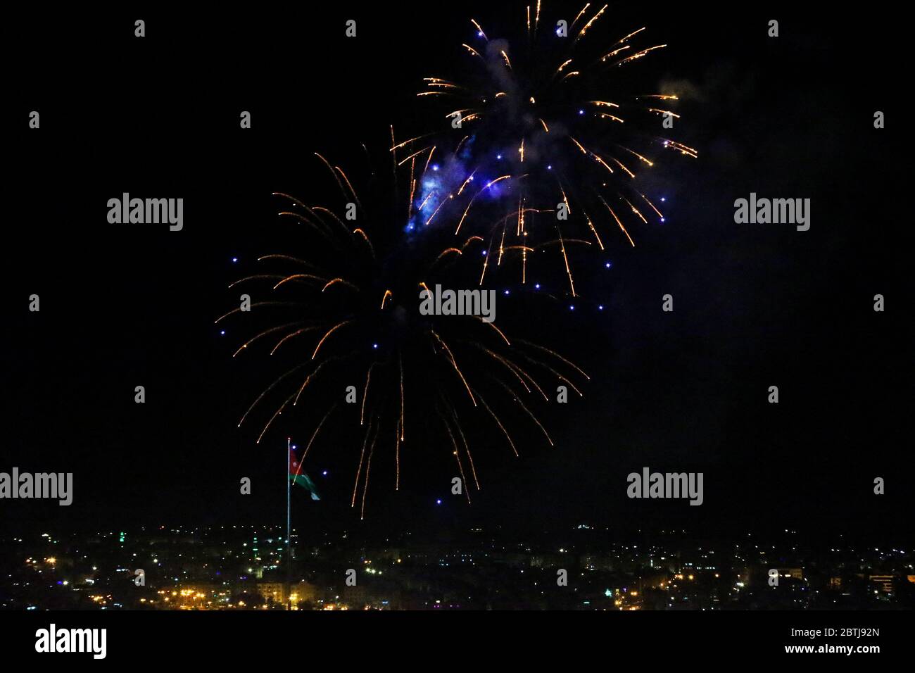 May 25, 2020: Amman, Jordan. 25 May 2020. Fireworks are displayed in Amman to celebrate the 74th anniversary of Jordan Independence Day. The commemoration of Jordan National Day, which is celebrated every year on 25th May, included fireworks, military parades, and a speech by King Abdullah II of Jordan. Independence Day marks the country's independence from British rule on 25 May 1946, and the following declaration of the Hashemite Kingdom of Jordan. The national flag was widely displayed to symbolise the significance of the day for the country (Credit Image: © Stringer/IMAGESLIVE via ZUMA Stock Photo
