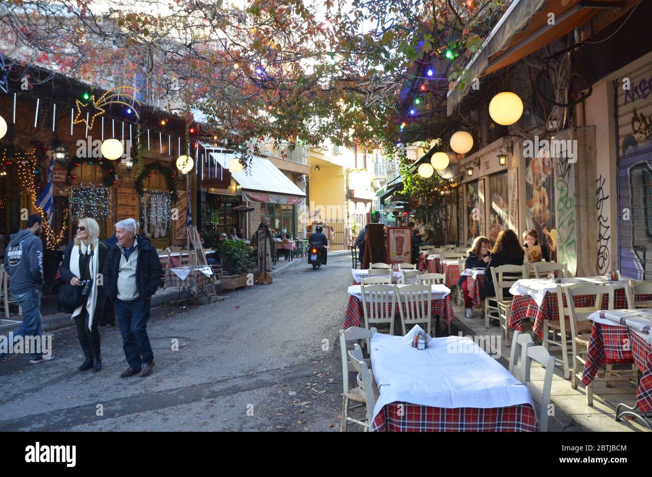 Plaka District, which resides under the Acropolis and spreads out to Syntagma. The area is well-known for its food, boutique shops and cafes. Stock Photo