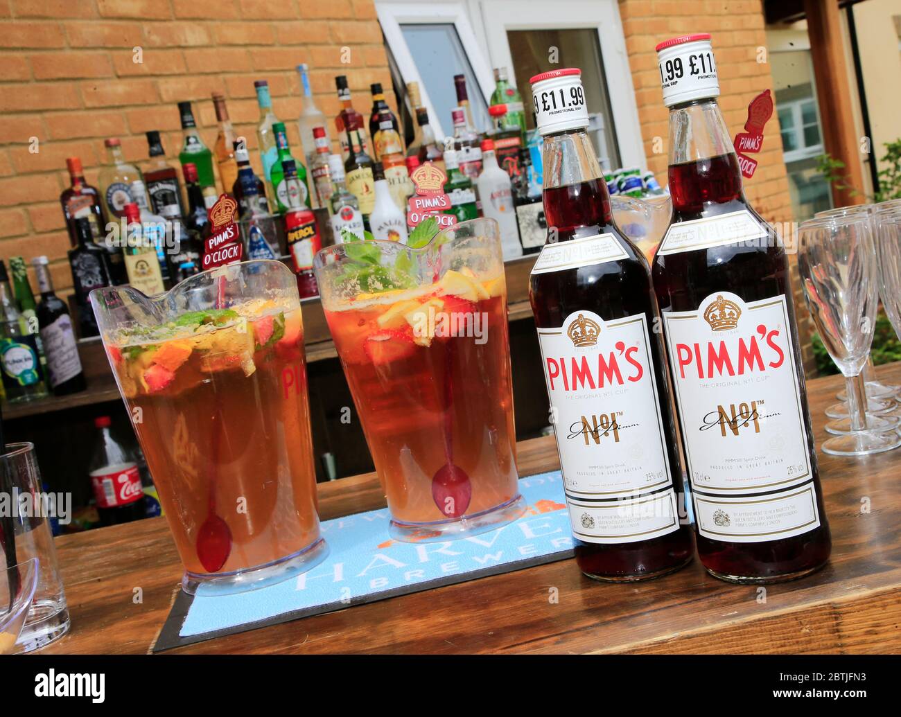 Bottles of Pimms on a bar. Stock Photo