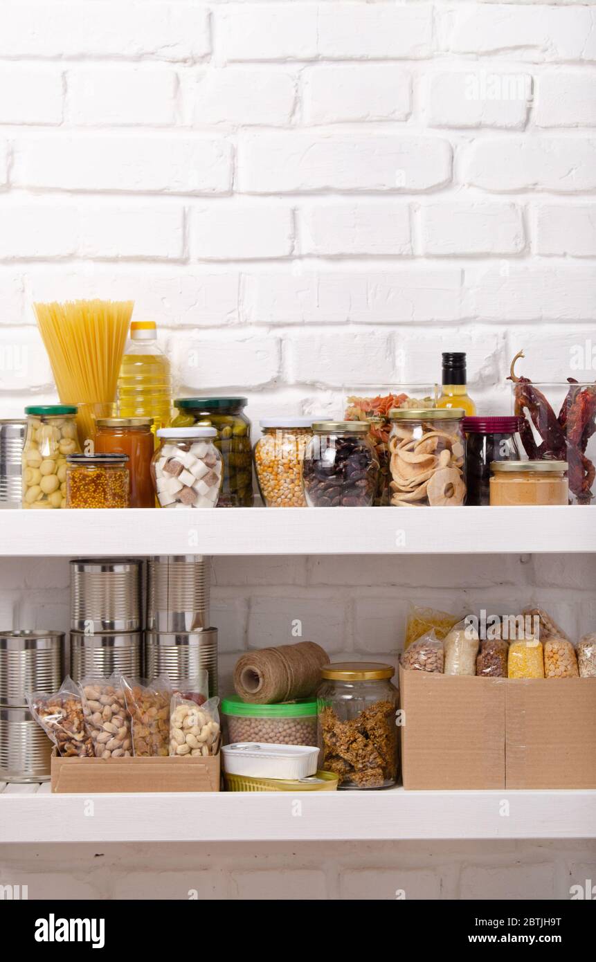 Set of long storage term foods on pantry shelf prepared for disaster