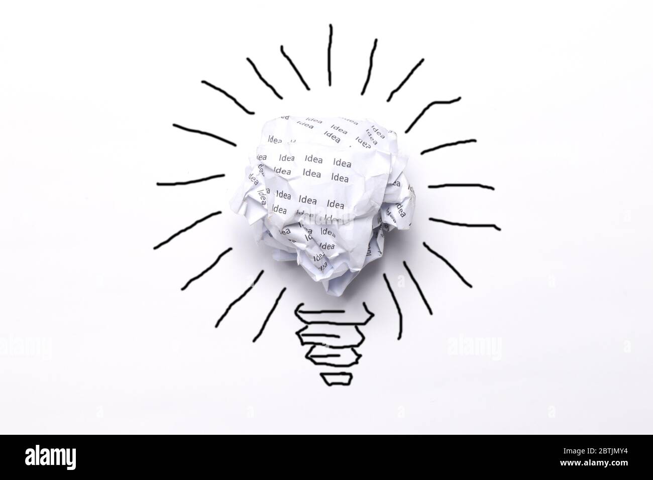 Creativity inspiration, ideas concepts with light bulb from white paper crumpled ball Stock Photo