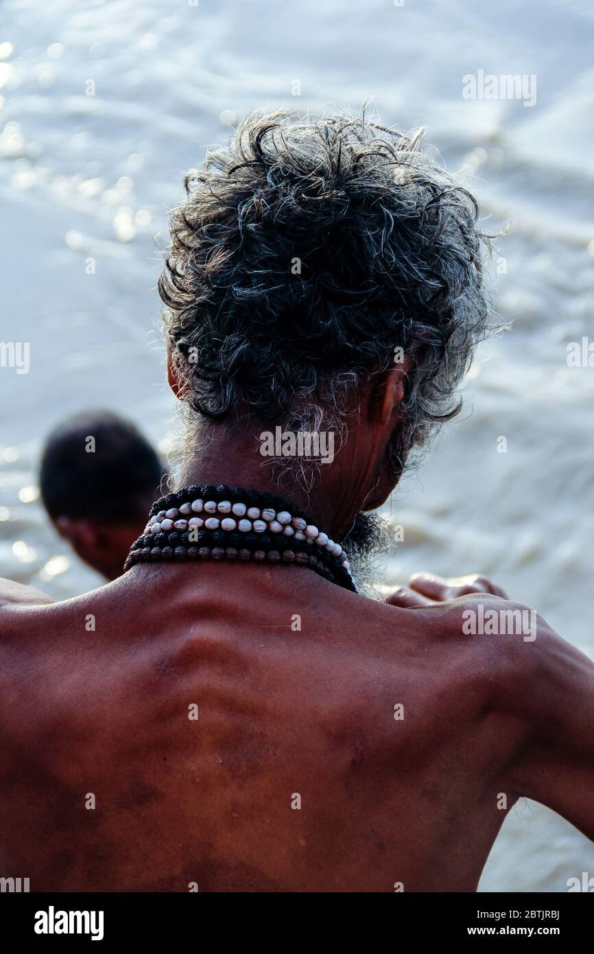 India, Varanasi - Uttar Pradesh state, 31st July 2013. In the morning, a man performs his prayers at the Ganges river. Stock Photo