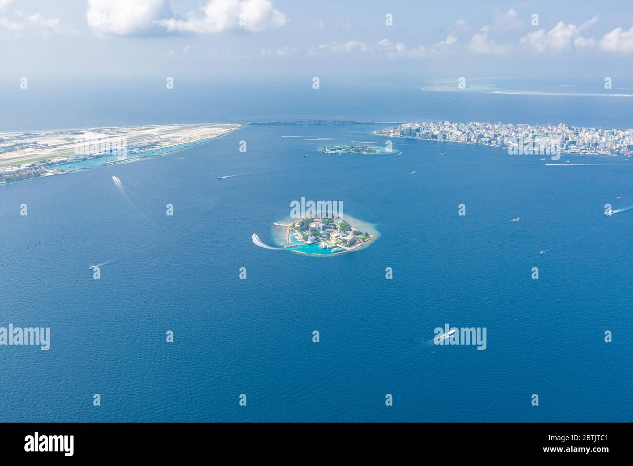 Maldives island capital island, Male. Hulhumale city island view from over the clouds. Aerial landscape in exotic travel destination Stock Photo