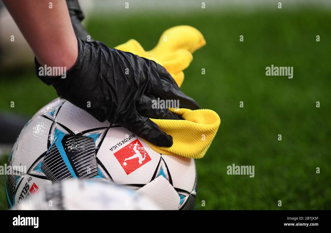 Leverkusen, Germany. 26th May, 2020. Football: Bundesliga, Bayer Leverkusen - VfL Wolfsburg, 28th matchday in the BayArena. The match ball will be disinfected before the game. IMPORTANT NOTE: In accordance with the regulations of the DFL Deutsche Fußball Liga and the DFB Deutscher Fußball-Bund, it is prohibited to use or have used in the stadium and/or photographs taken of the game in the form of sequence images and/or video-like photo series. Credit: Marius Becker/dpa-Pool/dpa/Alamy Live News Stock Photo
