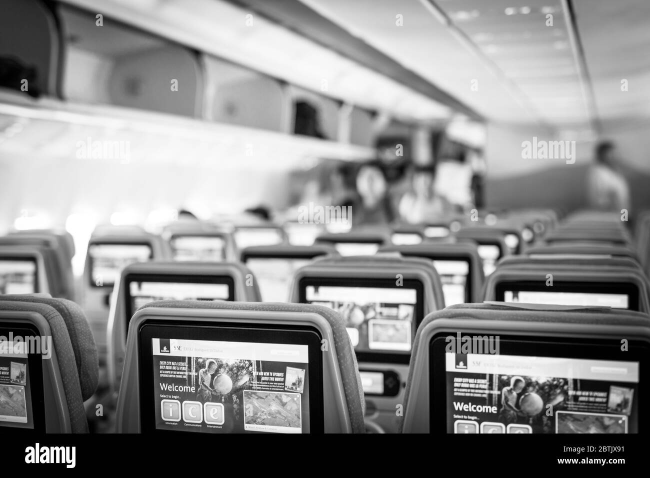 Dubai, UAE - February 13, 2020: Emirates new economy class seats with modern multimedia system and large screens of high resolution and touchscreen Stock Photo