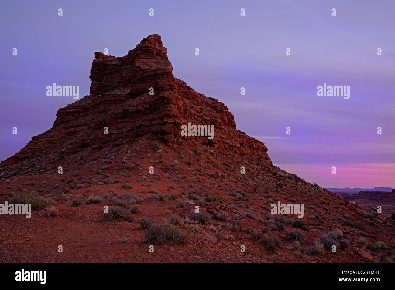 UT00680-00...UTAH - A butte at sunset in the Valley of the Gods; an area of Critical Environment Concern. Stock Photo