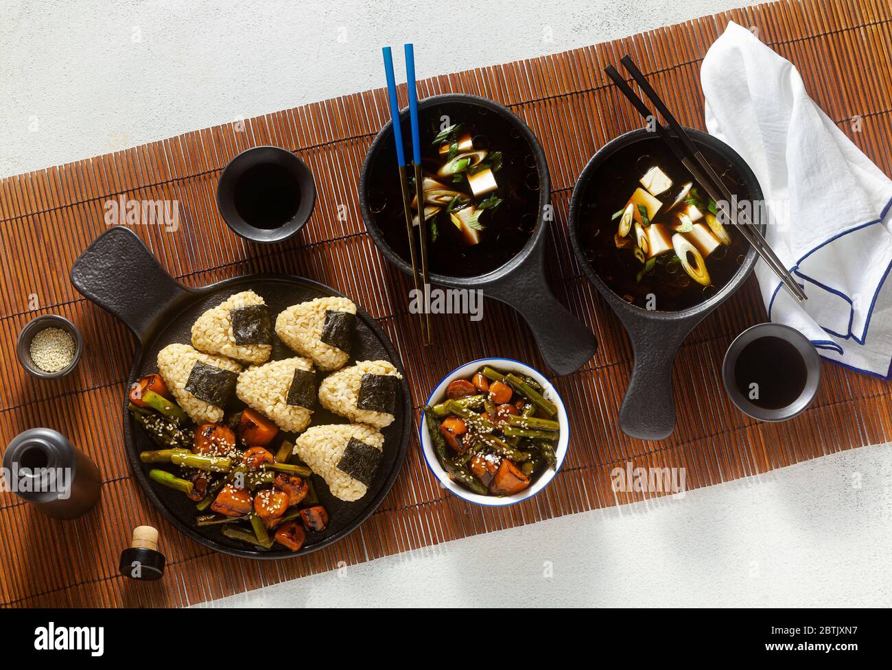 Japanese breakfast with miso soup, onigiri and vegetables in sweet and