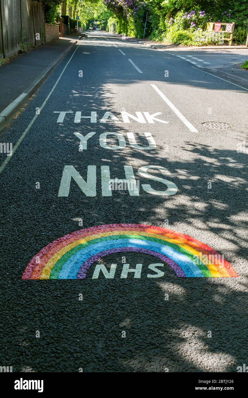Thank you NHS with rainbow painted on the road outside Fleet Community Hospital, Hampshire, UK, during the 2020 coronavirus covid-19 pandemic Stock Photo