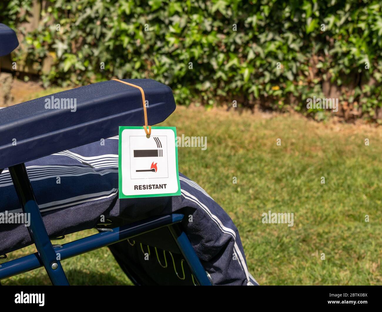 Fire safety regulation label on a sun lounger Stock Photo