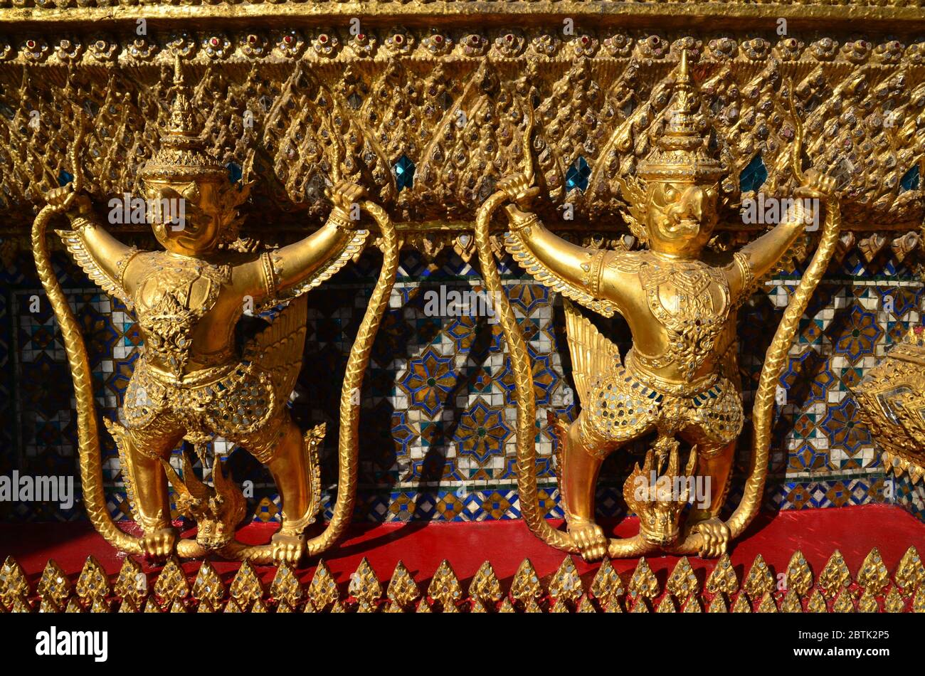 Dancing golden garudas at Wat Phra Kaew in Bangkok Stock Photo