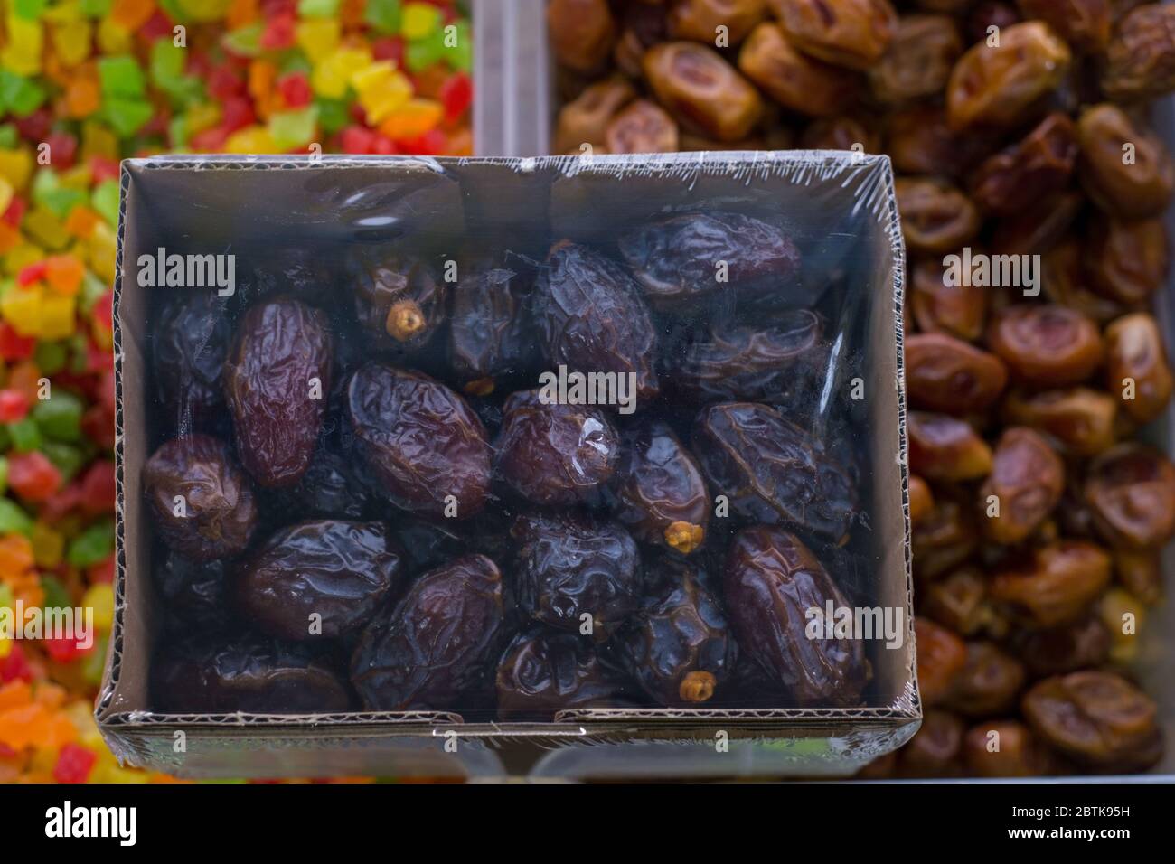 Dried dates Fruit store counter with dried fruits. In plastic
