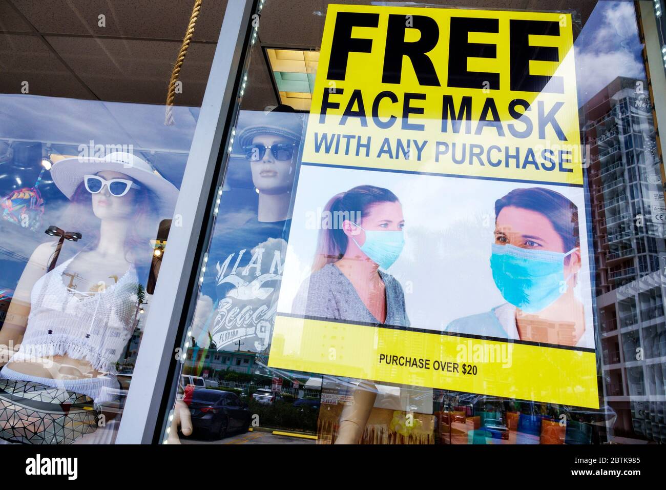 Miami Beach Florida,gift store souvenirs,shopping,free face mask with any purchase over $20 promotion,Covid-19 coronavirus pandemic crisis illness,sig Stock Photo