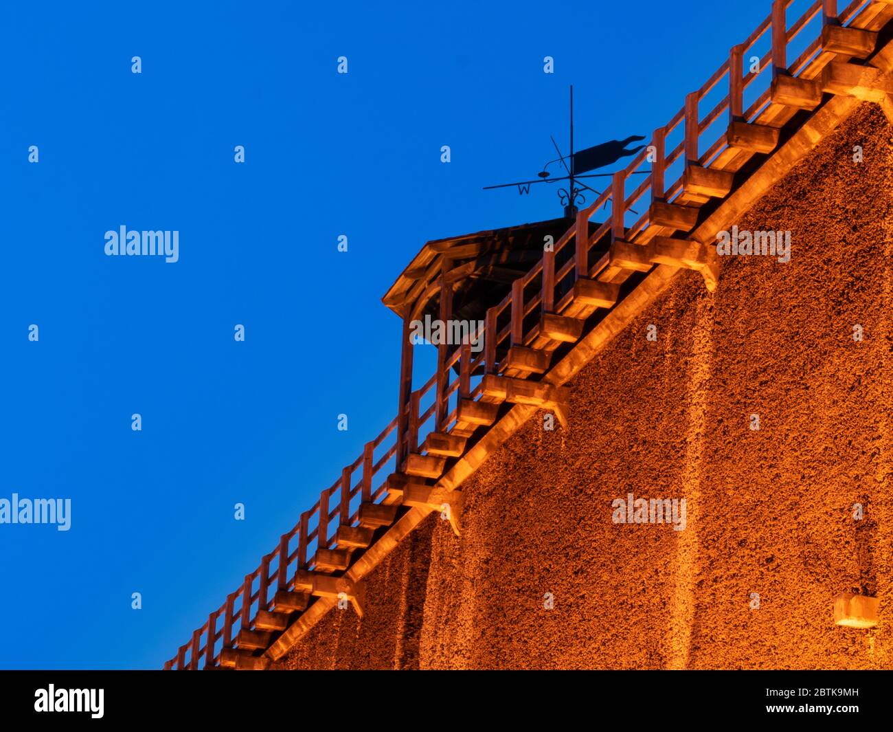 old graduation tower with weather vane (salt extraction, thorn house), blue hour, park in Bad Rothenfelde Stock Photo