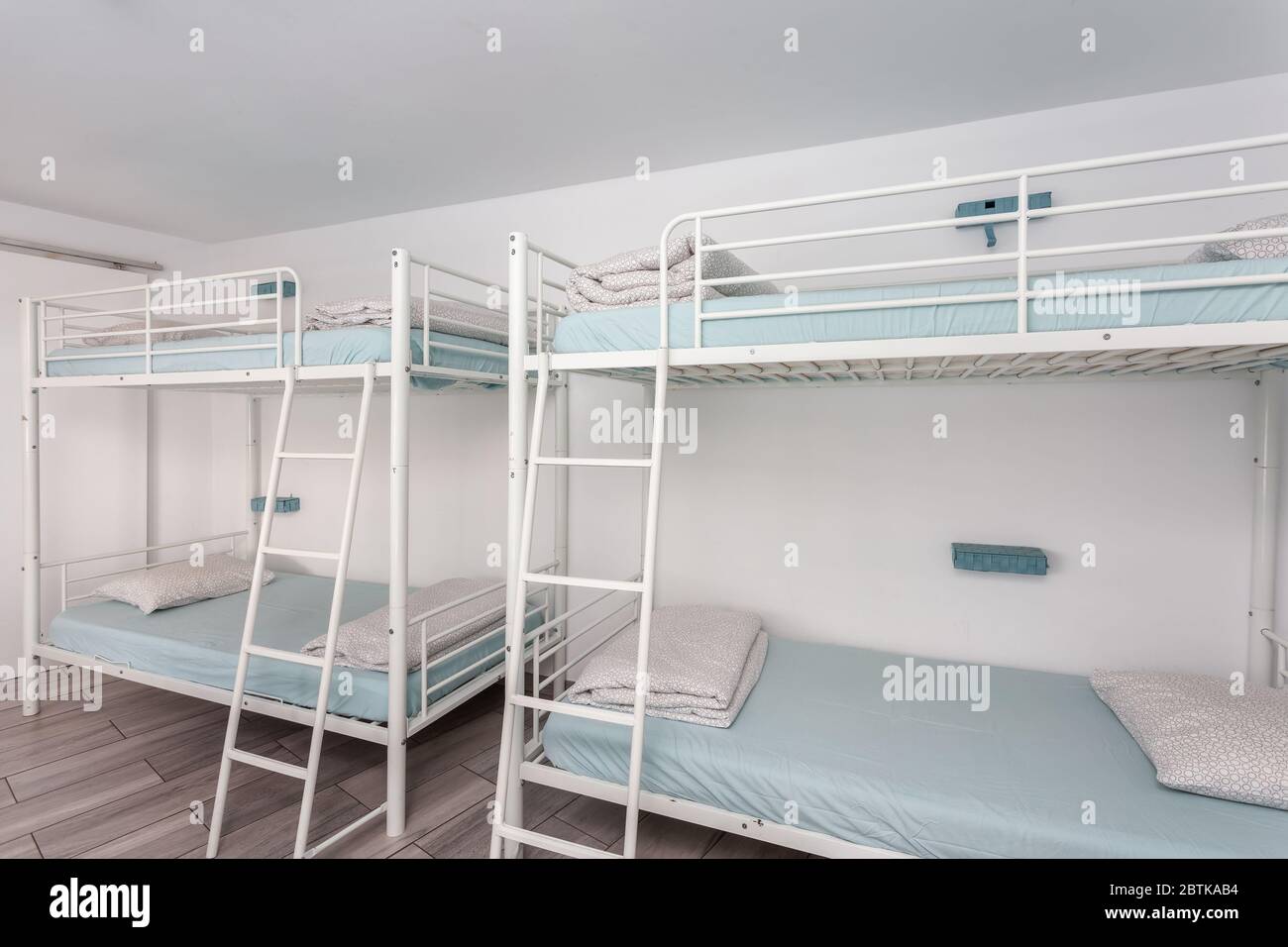 Clean bedroom with bunk beds in a hotel, a hostel for tourists Stock