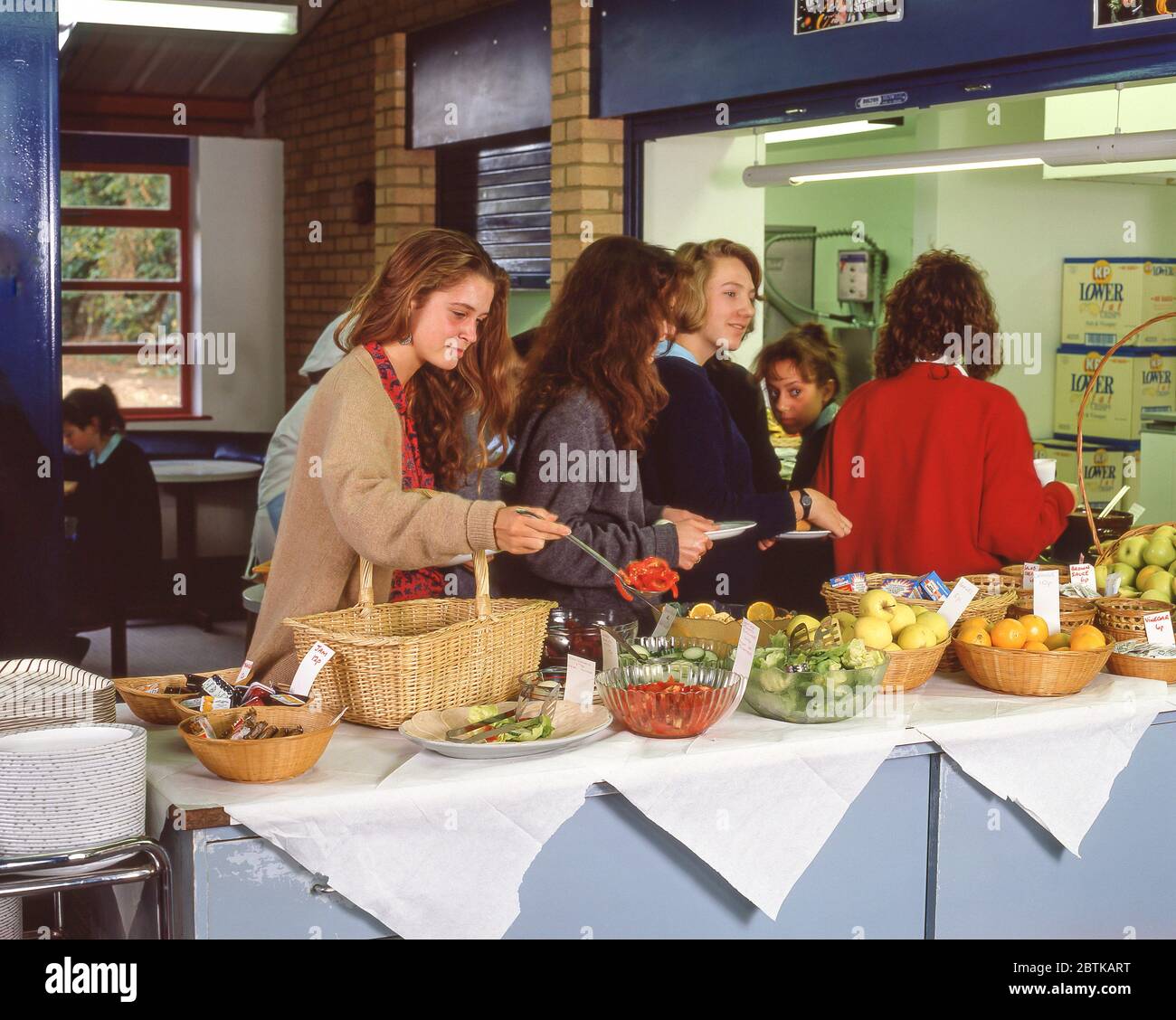 Children at secondary school canteen, Surrey, England, United Kingdom Stock Photo