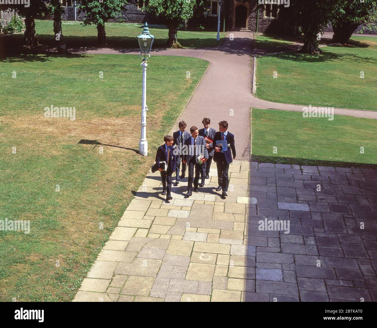 Senior boys walking in grounds of school, Surrey, England, United Kingdom Stock Photo