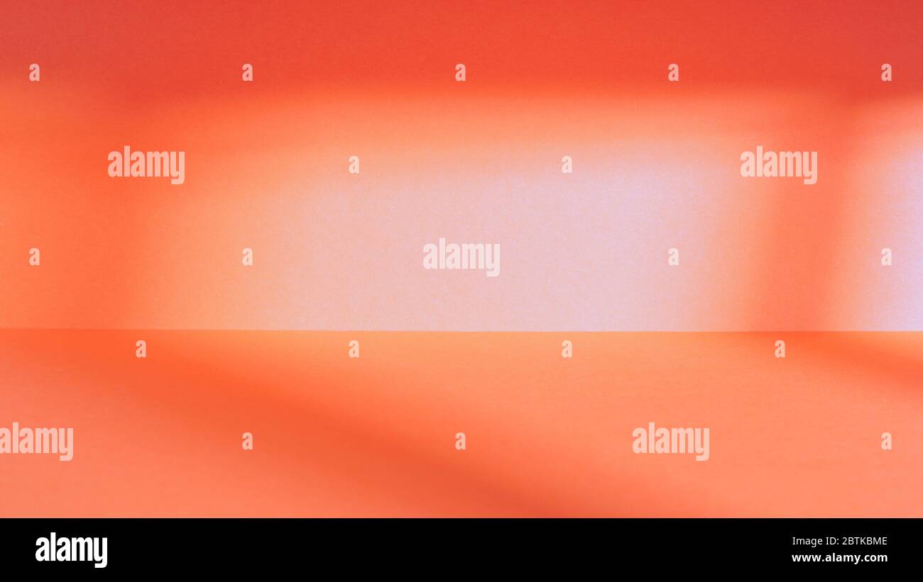 Empty red studio space with deep windows shadow. Sparse panoramic template and background Stock Photo