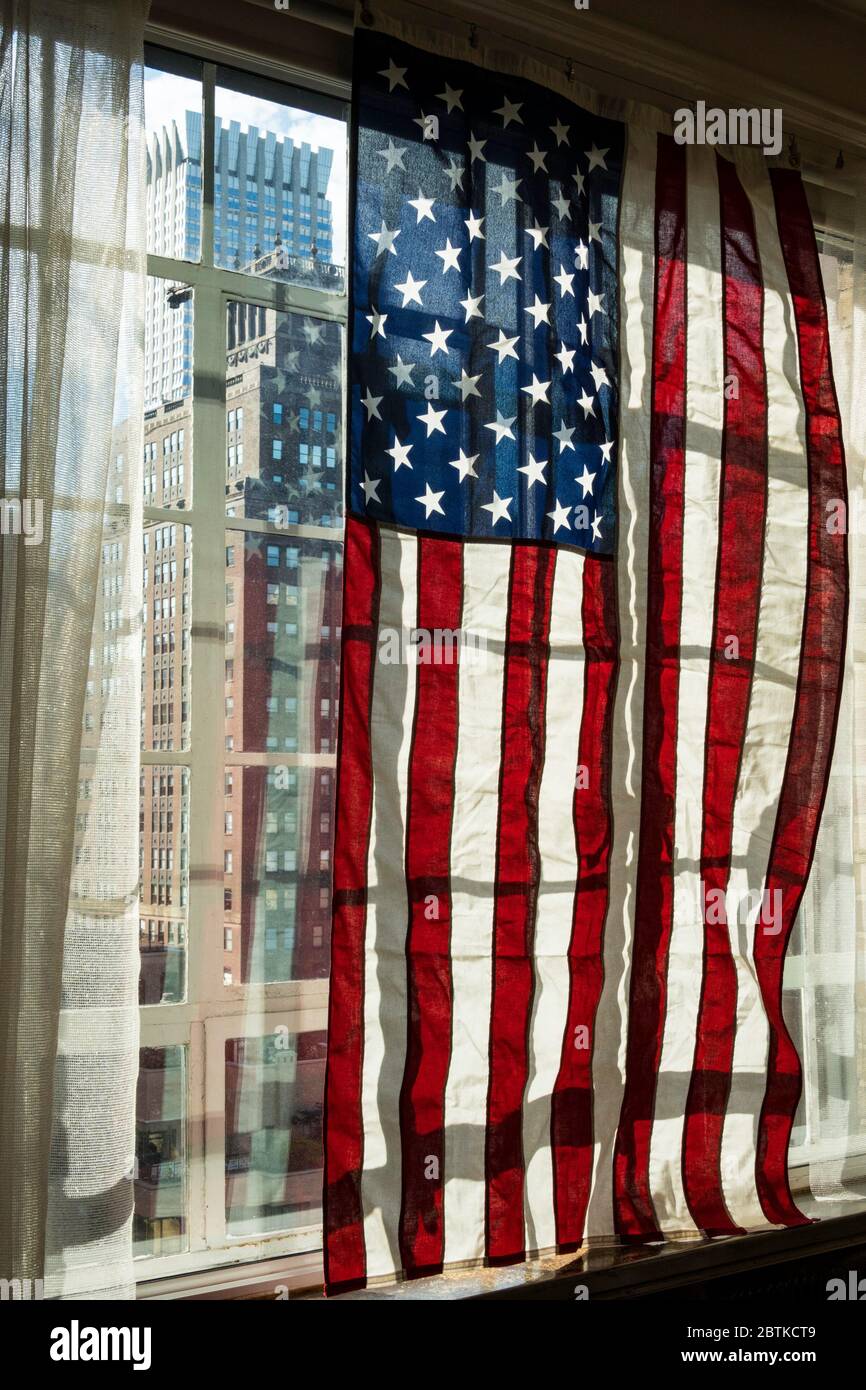 View of American flag in a window hi-res stock photography and images - Alamy