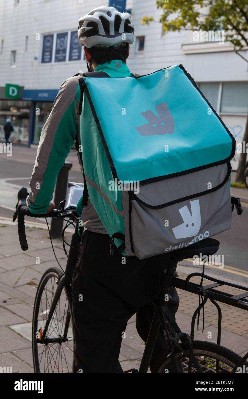 Deliveroo courier in Brighton, East Sussex Stock Photo