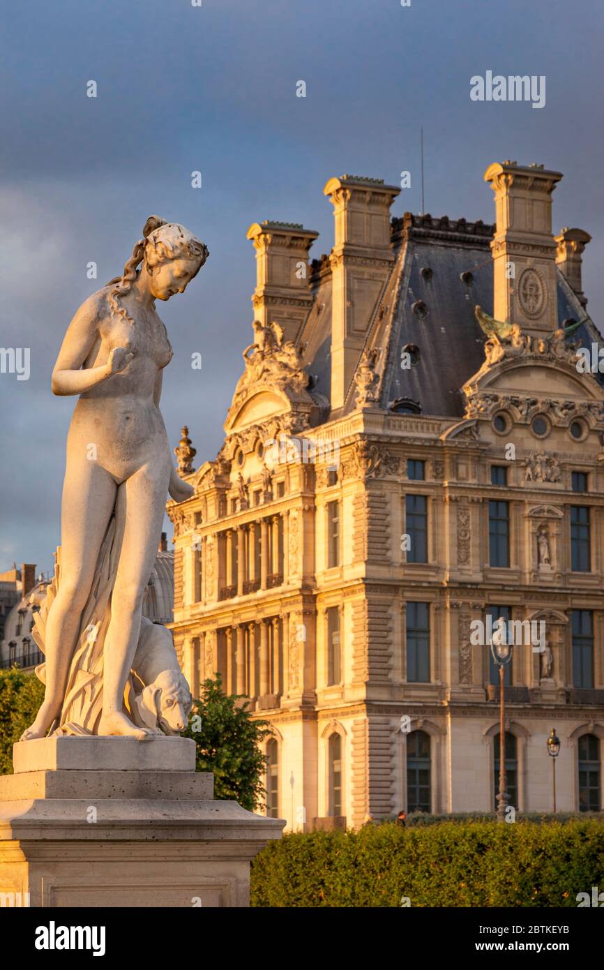 Statue in Jardin des Tuileries with Musee du Louvre beyond, Paris France Stock Photo