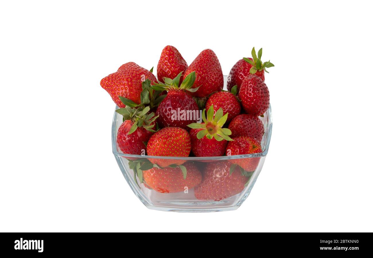 fresh strawberry berries in a glass container, isolated on a white background. richest source of nutrients and vitamins Stock Photo
