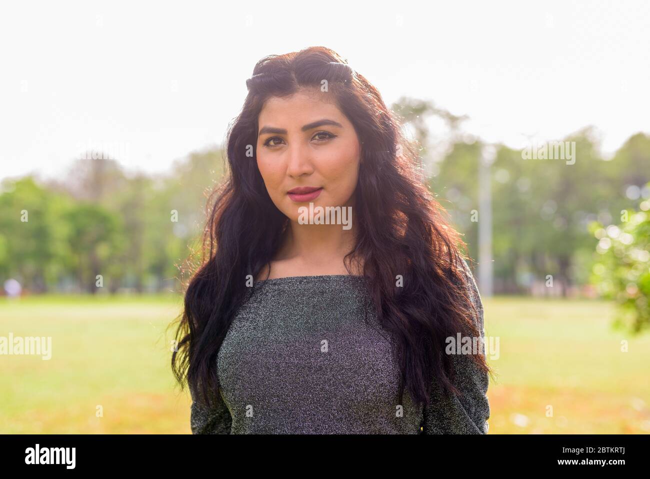Young beautiful Indian woman at the park outdoors Stock Photo - Alamy