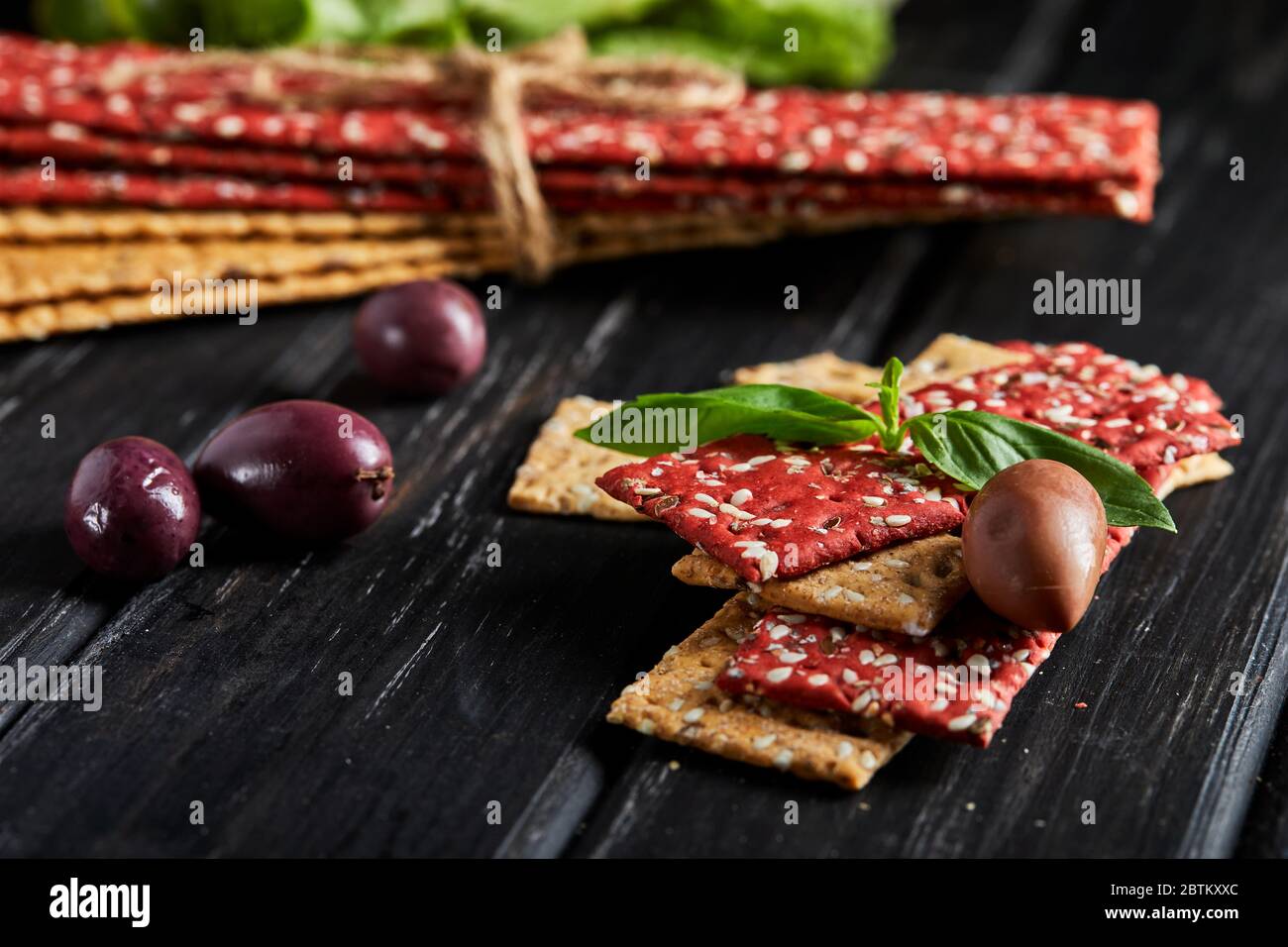Beetroot and rye flour crackers with vegetables for making snacks on a ...