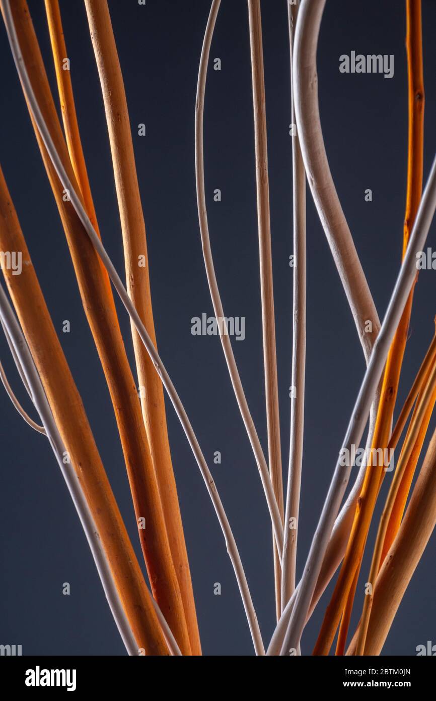 Abstract lines and shapes, oranges and greys against a grey background Stock Photo