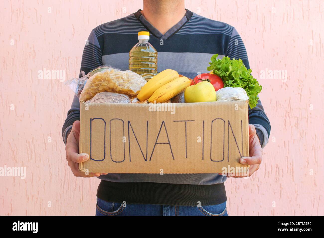 Man giving donation box hi-res stock photography and images - Alamy