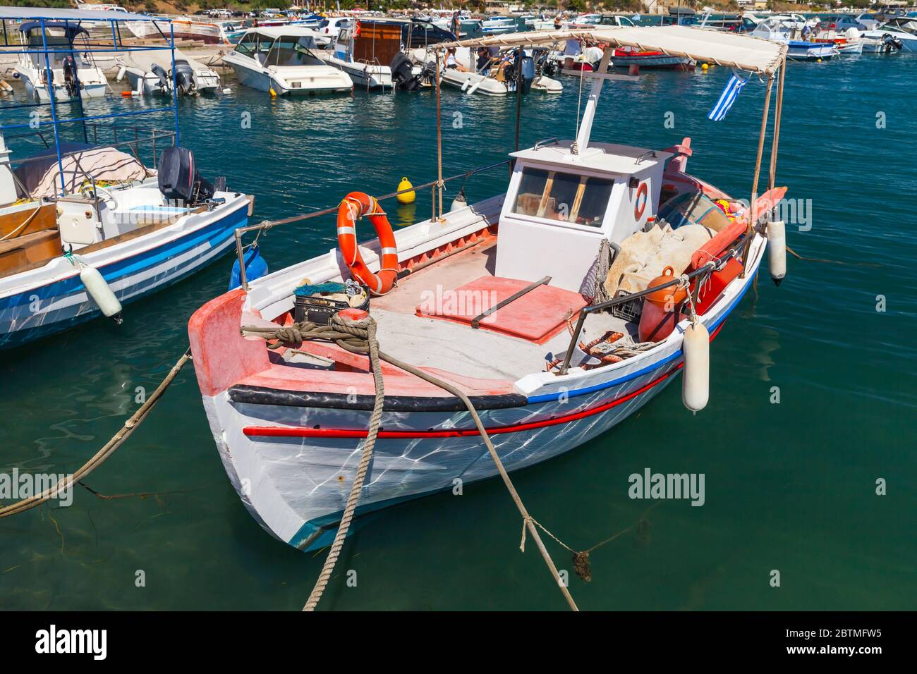 Vintage wooden fishing boat is moored in Greek village. Zakynthos