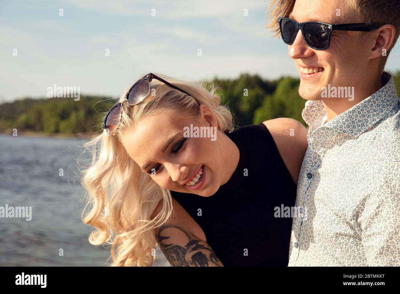 Young Couple Enjoying Summer Vacation At Beach Stock Photo