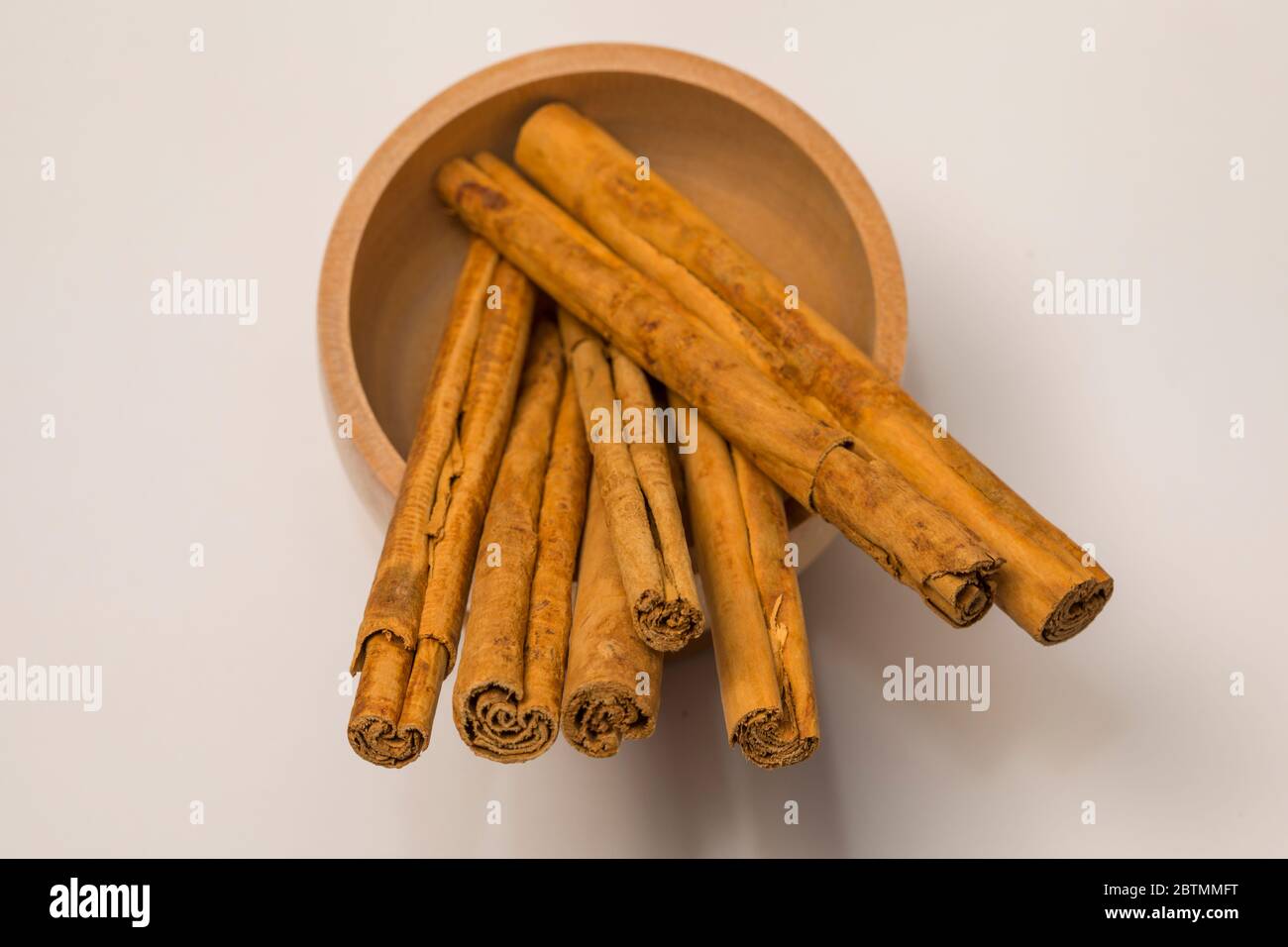 Close-up view of cinnamon sticks on white background. Stock Photo