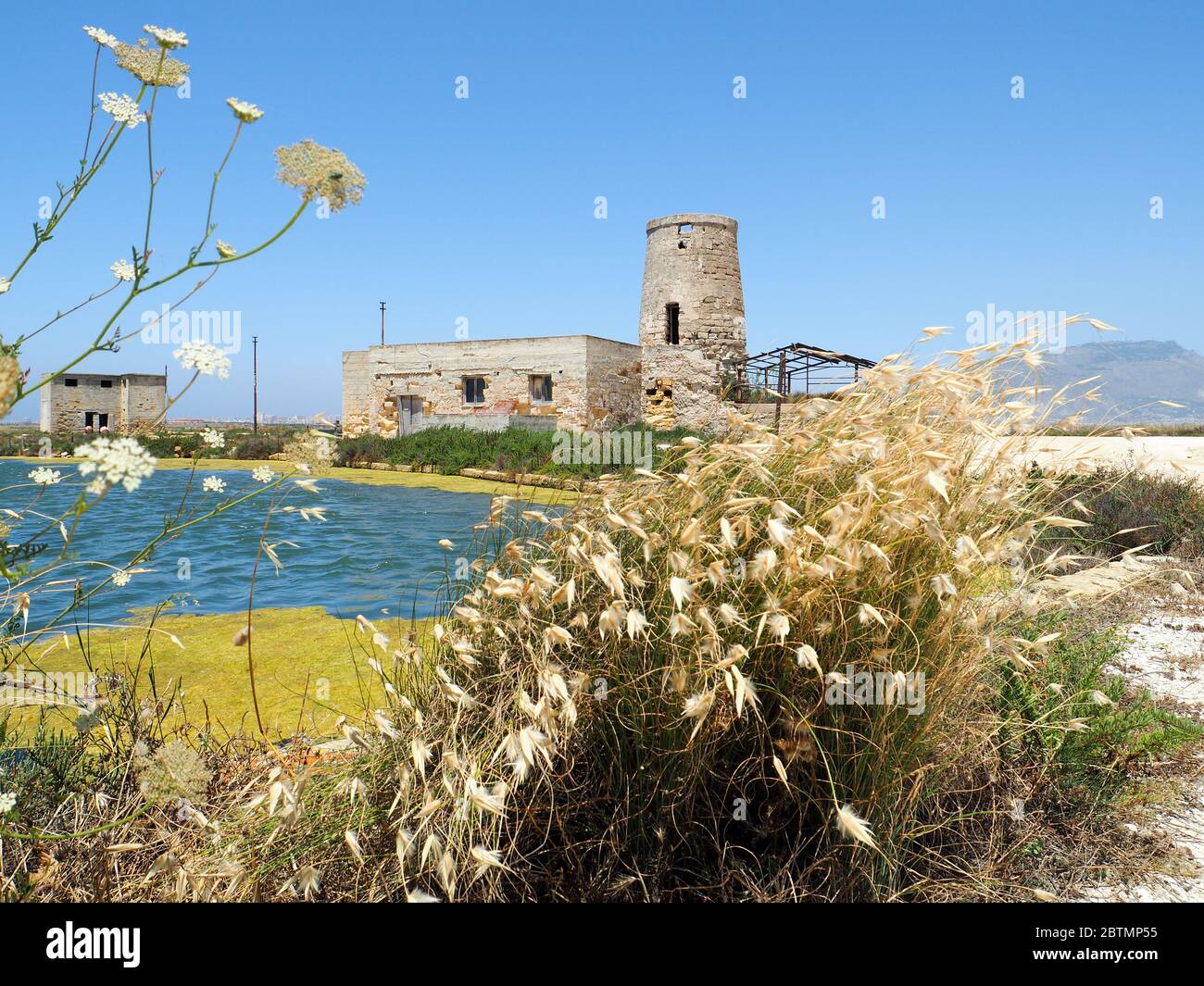 a old windmill for making salt in sicily Stock Photo