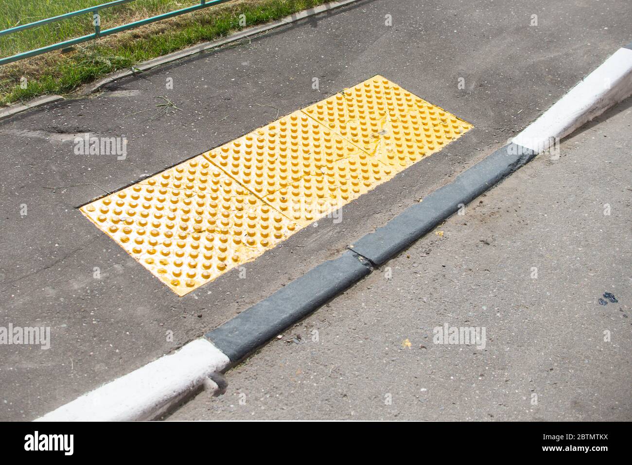 Braille Blocks in the pedestrian guiding the blinds walks. Traffic and urban life safety Stock Photo