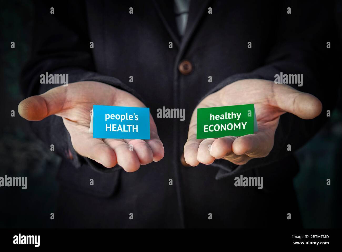 balanced decision between human health or maintaining the economy during the covid-19 coronavirus pandemic. Economic crisis or risk of infection is a Stock Photo