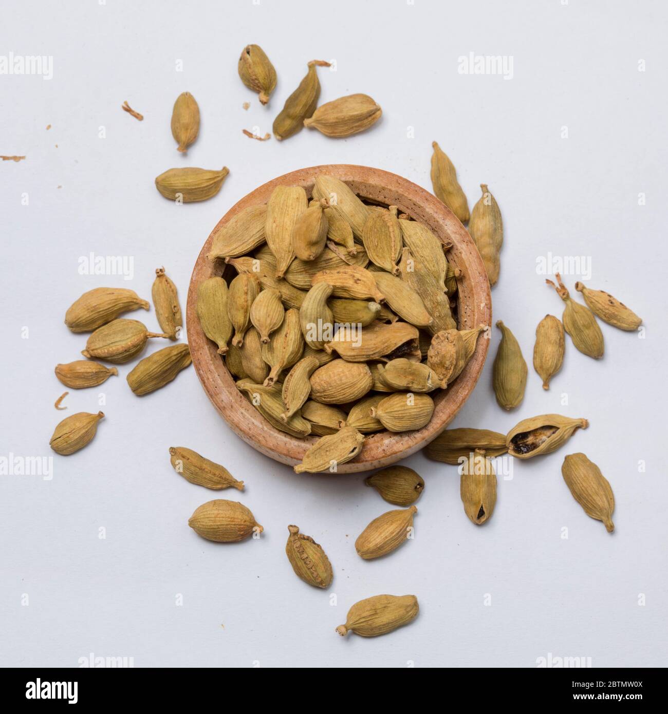 Close-up view of cardamoms on white background. Stock Photo