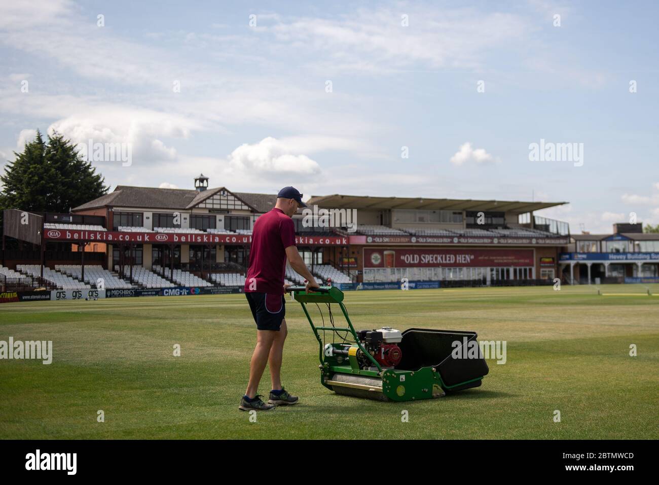 Head groundsman Craig Harvey tends to the outfield at the County Ground, home of Northamptonshire County Cricket Club, as professional cricket waits to be given the green light to return following the coronavirus pandemic. Stock Photo