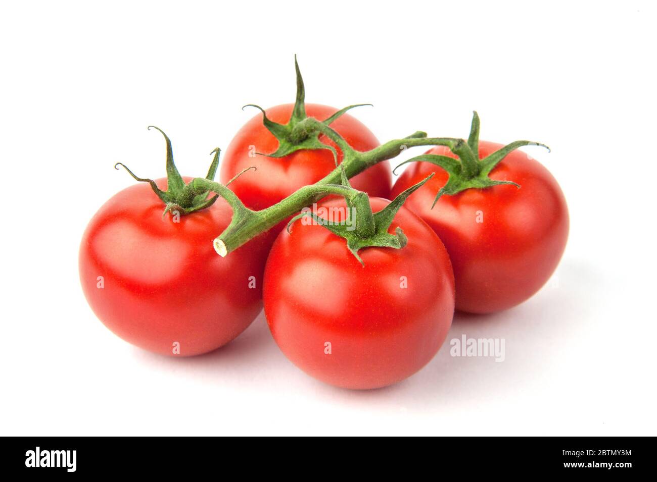 Branch of ripe cherry tomatoes isolated on white background Stock Photo ...