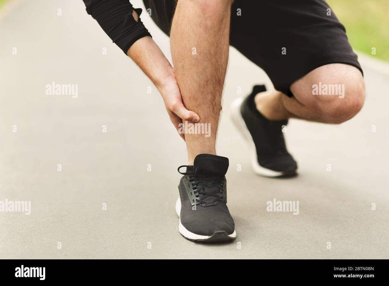 Calf sport muscle injury. Runner with muscle pain in leg Stock Photo