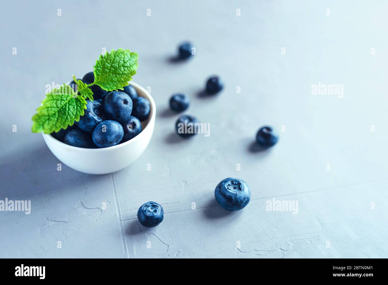 Fresh blueberries in a white bowl. Stock Photo