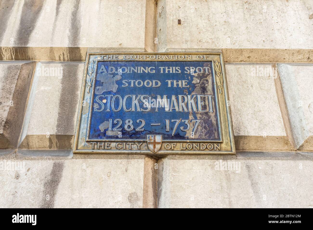 Sign noting the historical site of London's main retail and produce market known as the Stocks Market, located at the current Mansion House in the Cit Stock Photo
