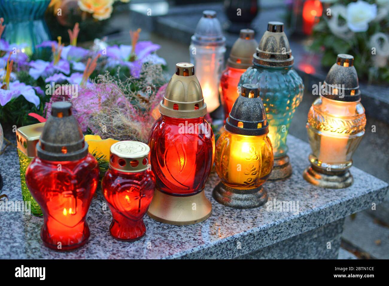 Lighting candles on the grave. All the Saints Day holiday on 1 November in Poland Stock Photo