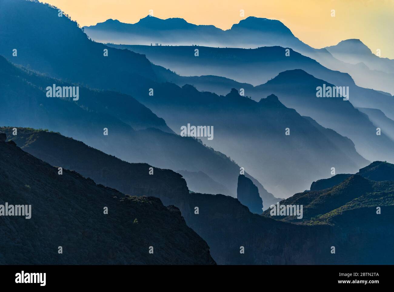 vanishing point of gran canaria ridge mountains shot from the viewpoint rock of roque nublo Stock Photo