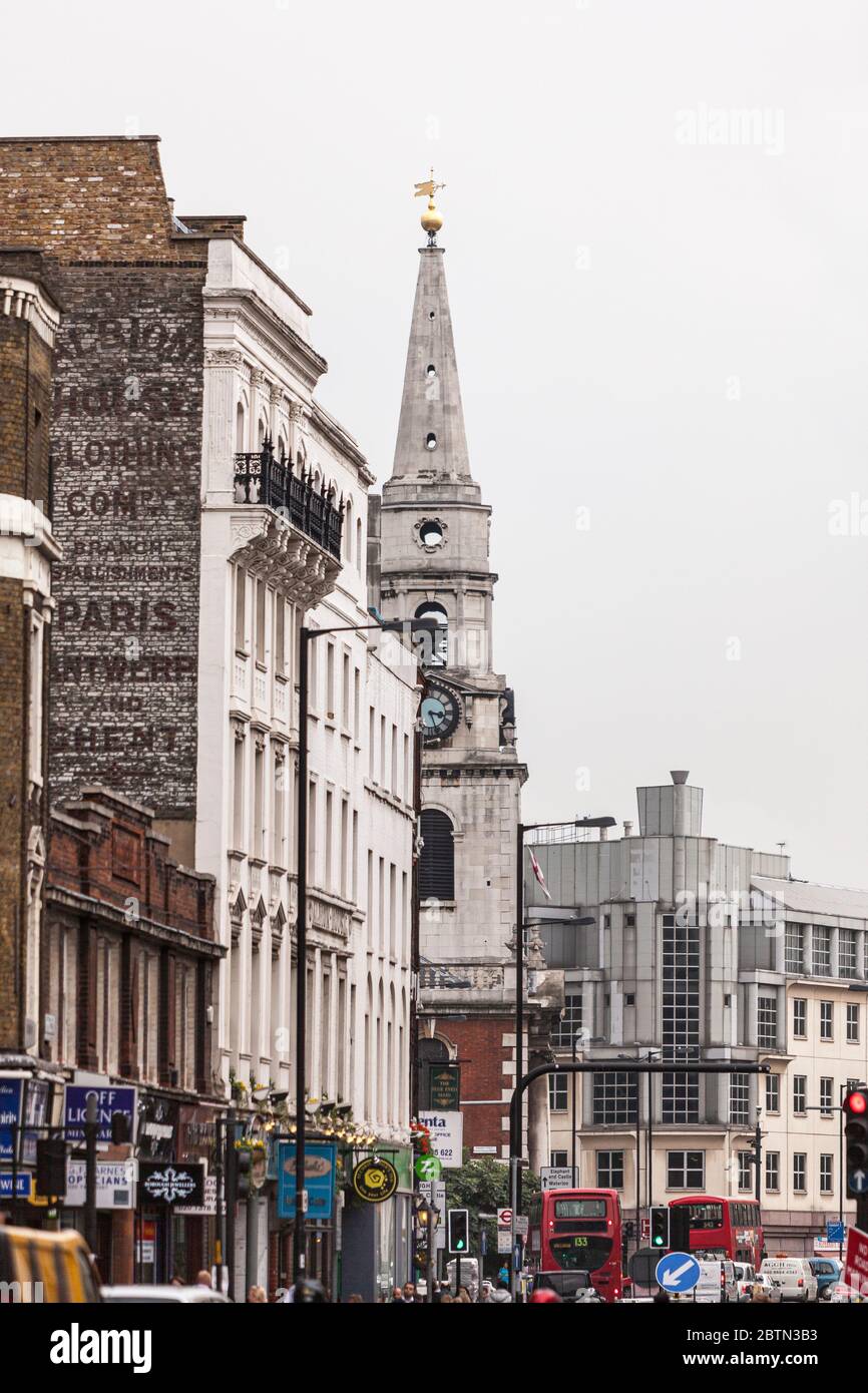 The varying architecture of Borough High Street featuring St. George the Martyr church in Borough, Southwark, London, England Stock Photo