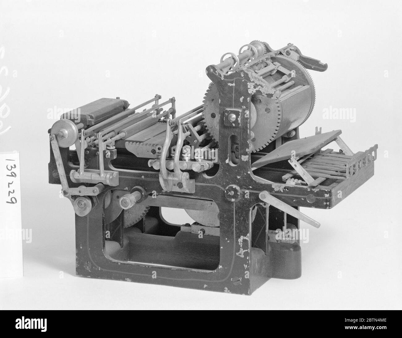 Patent Model for an Improvement in StopCylinder Presses. This patent model demonstrates an invention for improvement in stop-cylinder presses which was granted number 139229. The patent relates to the method of stopping and starting the cylinder, feeding and delivering paper, and distributing ink. Stock Photo