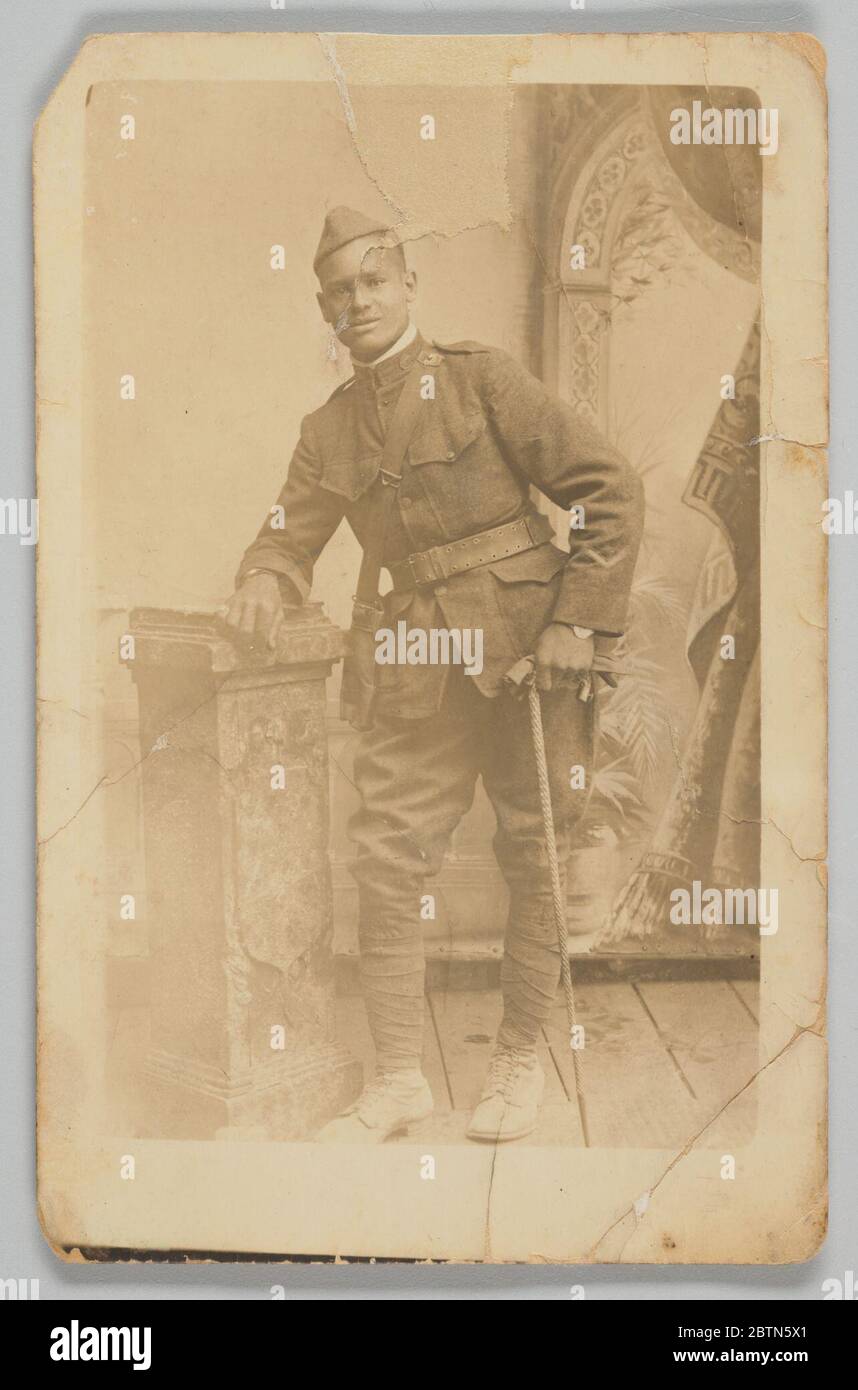 Photographic postcard of Cpl Lawrence Leslie McVey in uniform. Due to racial tension within the US Army, the 369th Infantry Regiment was assigned to the French Army for the duration of US involvement in World War I. Stock Photo