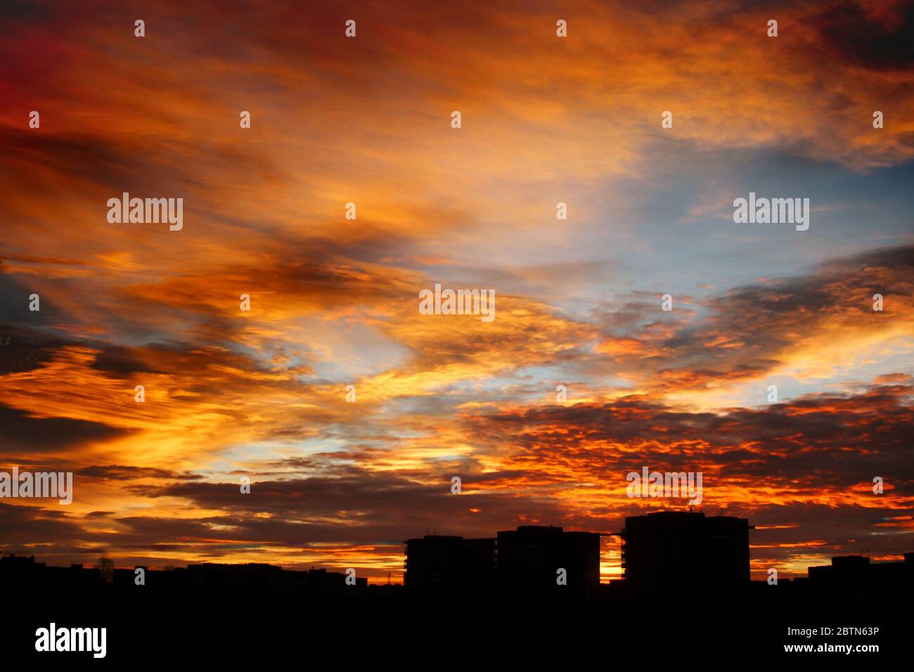 beautiful amazing view at sun rising over city buildings in summer ...