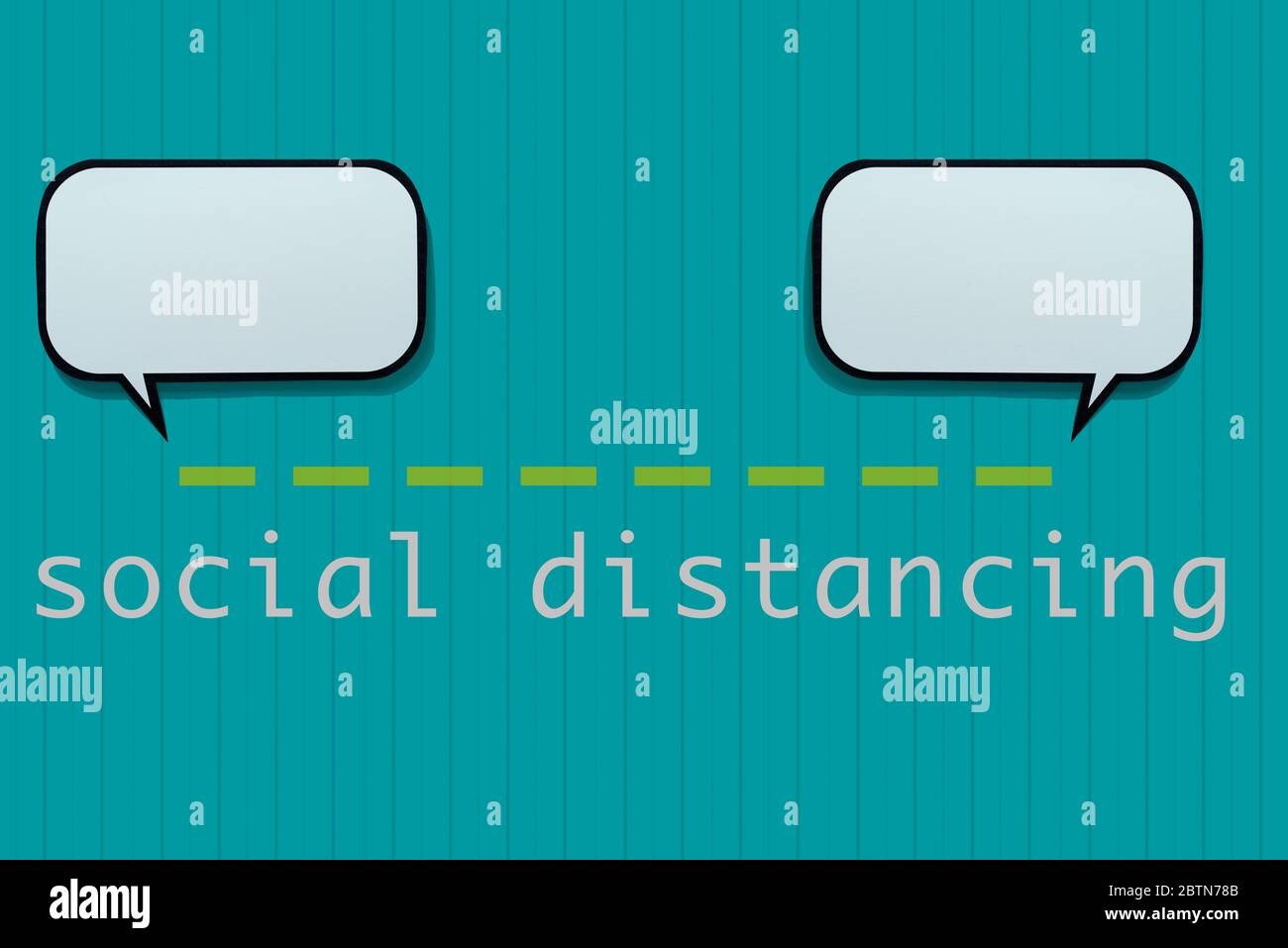 two speech balloons, separated in a certain distance by a green dashed line, and the text social distancing on a blue background patterned with vertic Stock Photo