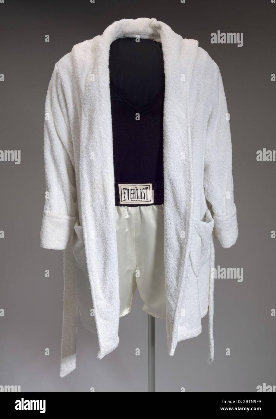 Robe and trunks worn by Denzel Washington as Rubin Carter in The Hurricane. A robe (.1ab) and a pair of boxing trunks (.2) worn by actor Denzel Washington as “Rubin ‘Hurricane’ Carter” in the 1999 biopic, “The Hurricane.”The robe (.1a) is a long-sleeved, knee-length, hooded white terry cloth robe with a belt (.1b). Stock Photo